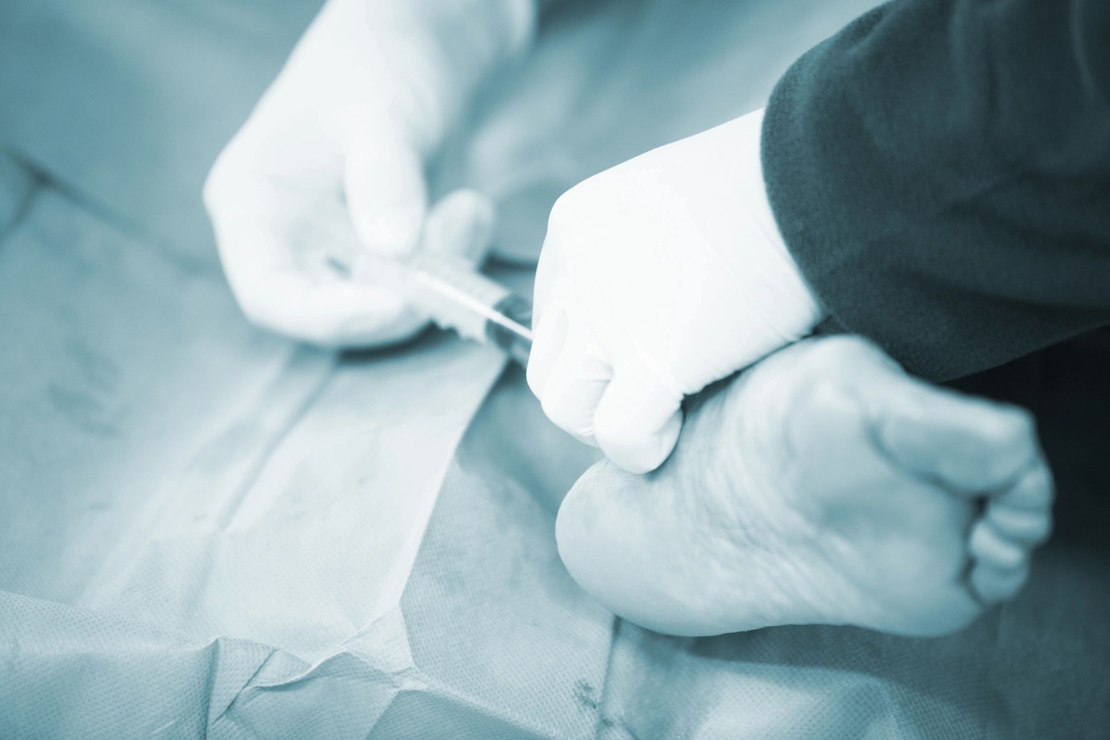 Podiatrist examining patient